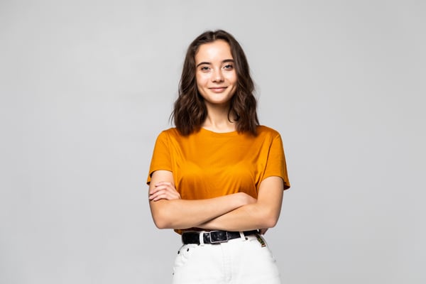 portrait-of-woman-standing-on-grey-wall